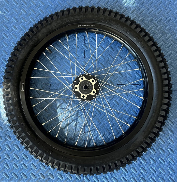 eMoto Shinko 241 Dual Sport 18" rear wheel and tire set for eMoto bikes, providing superior durability and traction for off-road and on-road adventures, designed for smooth and reliable performance in all conditions.