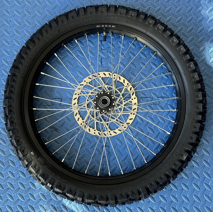 eMoto Shinko 244 Dual Sport 19" front wheel and tire set for eMoto bikes, available at eBike Super Shop, designed for superior traction and durability on both off-road trails and on-road surfaces, providing smooth performance across diverse terrains.